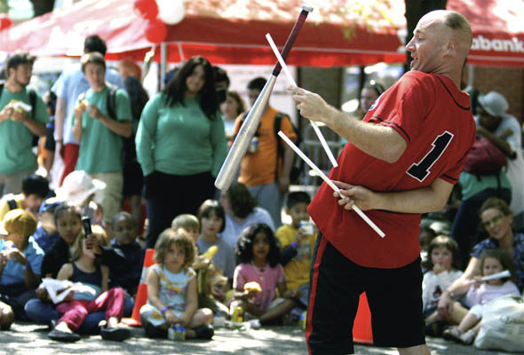 Mr. Spin from Australia entertains children at the kickoff for Toronto BUSKERFest