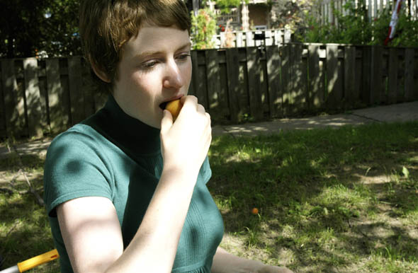Not Far From the Tree3 project coordinator, Laura Reinsborough enjoys an apricot during a pick