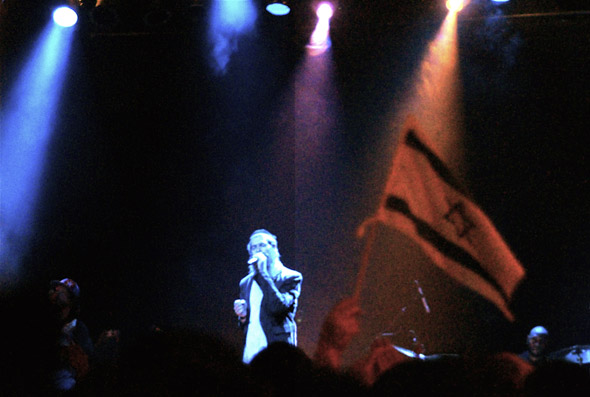 Matisyahu fan waves an Israeli flag at a concert in Toronto
