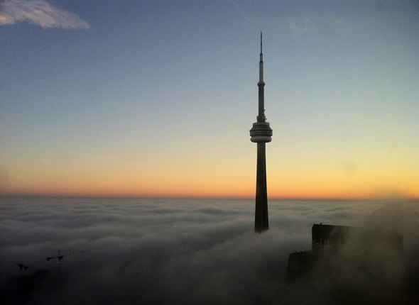 CN Tower above clouds